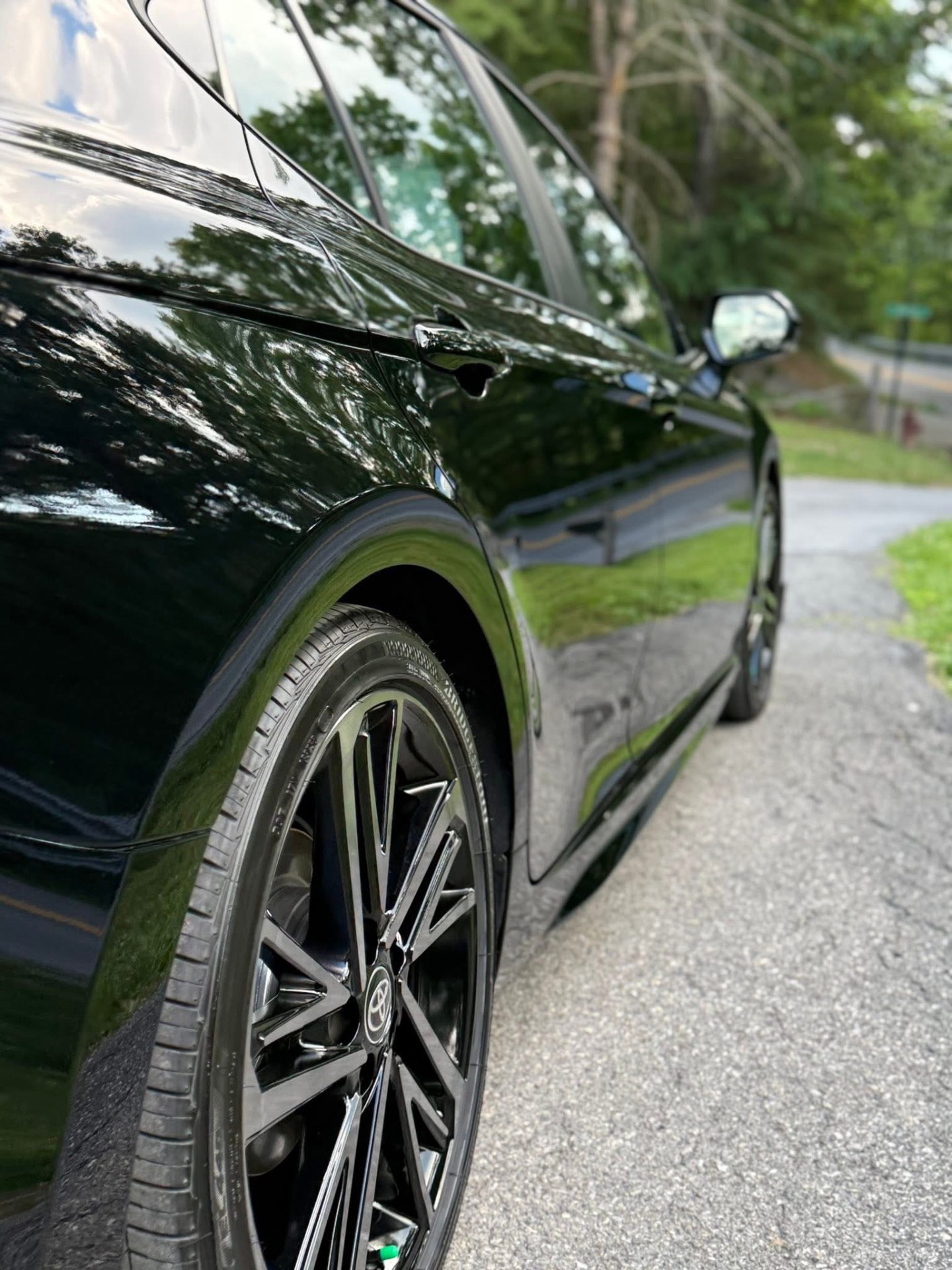 Glossy black car with a mirror-deep polished finish