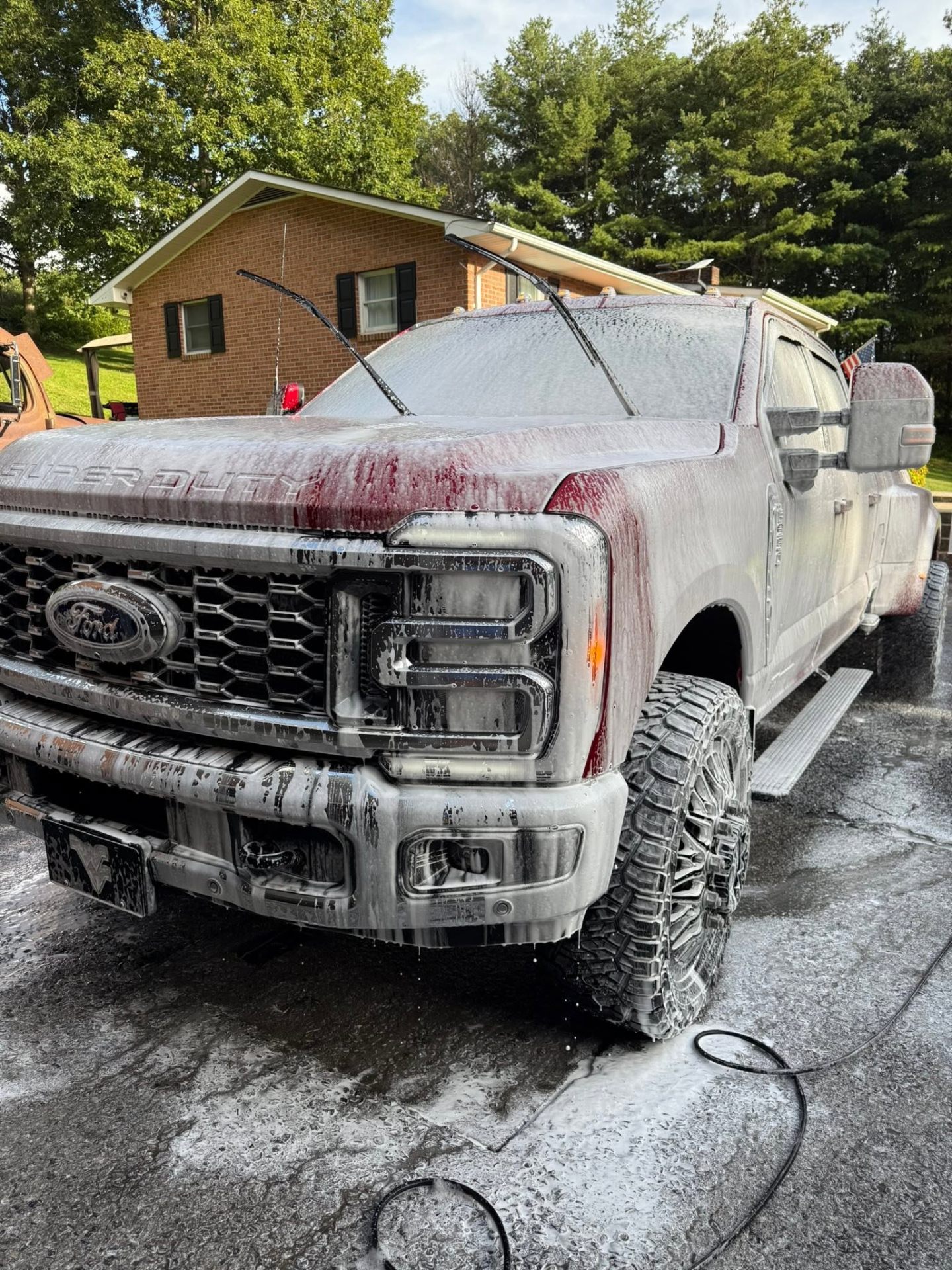 Ford Super Duty truck covered in foam during a wash