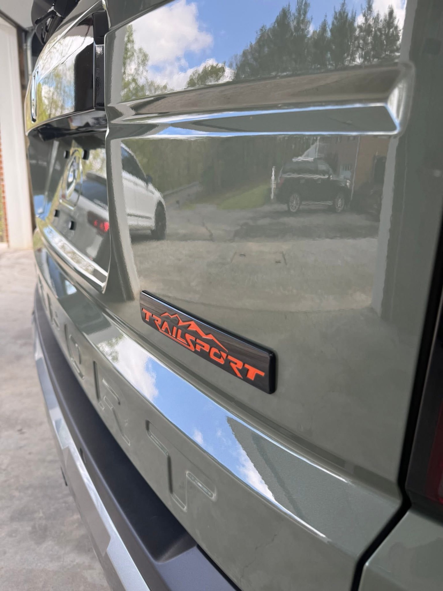 Close-up of a Honda TrailSport tailgate with a mirror shine