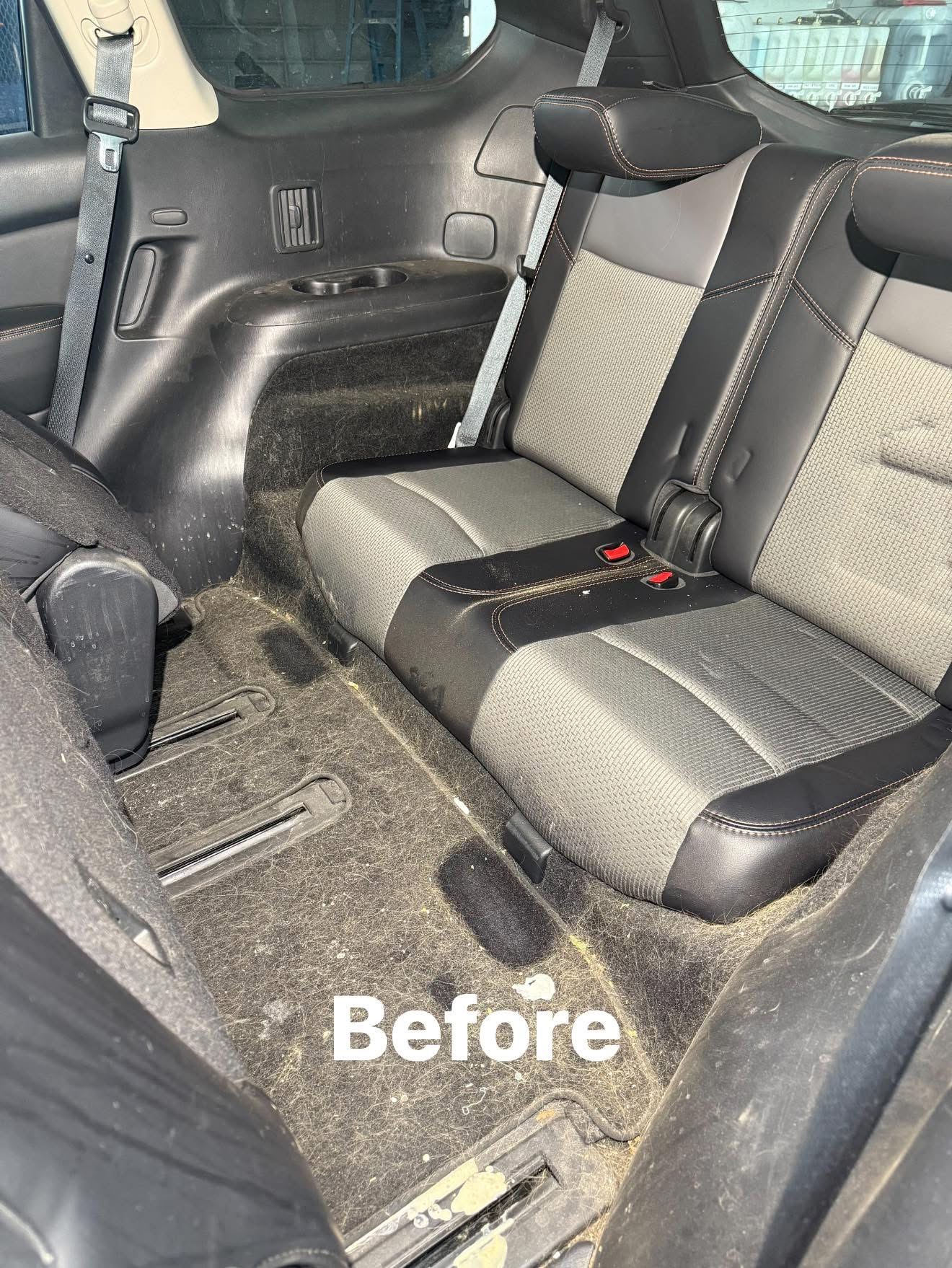 Car back seat before detailing — dusty seats and debris