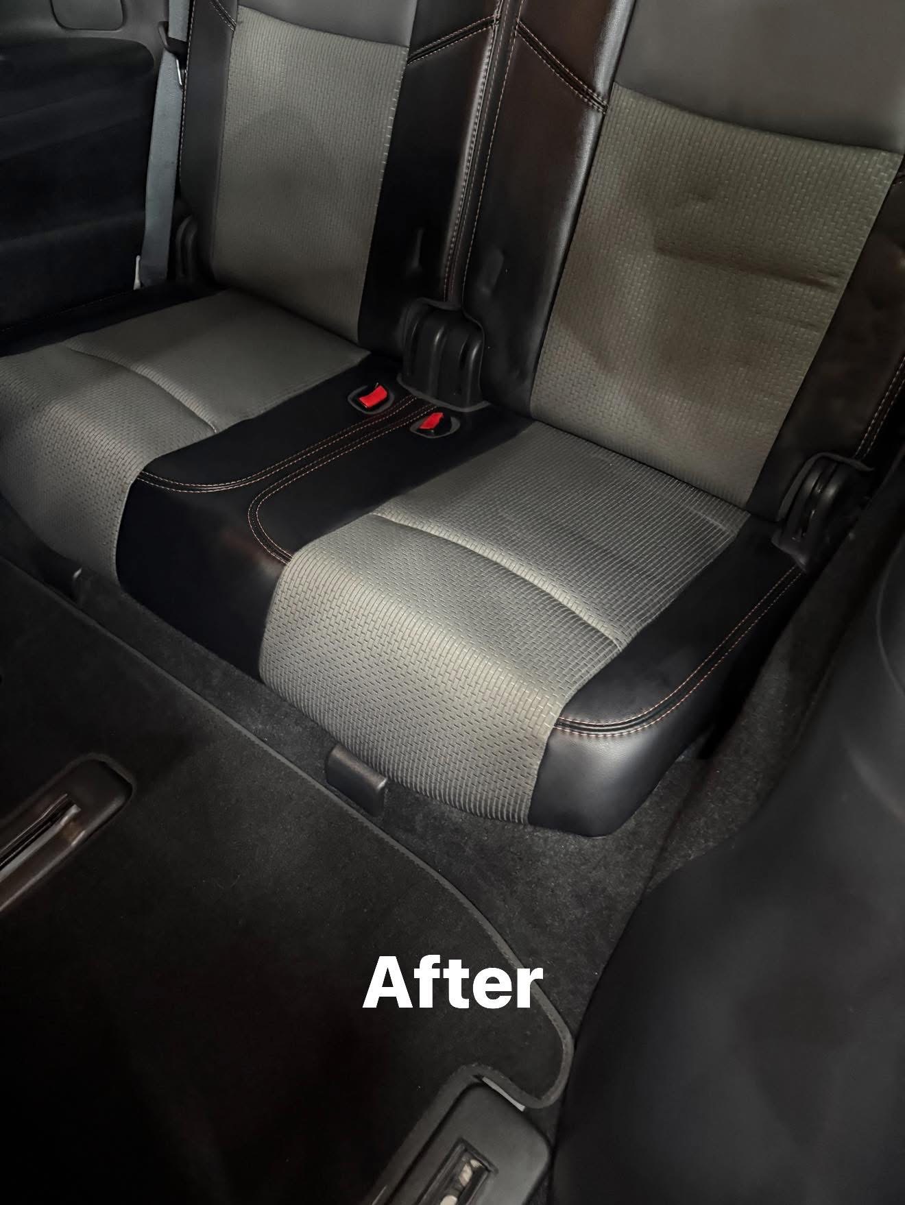 Car back seat after detailing — clean upholstery and carpet