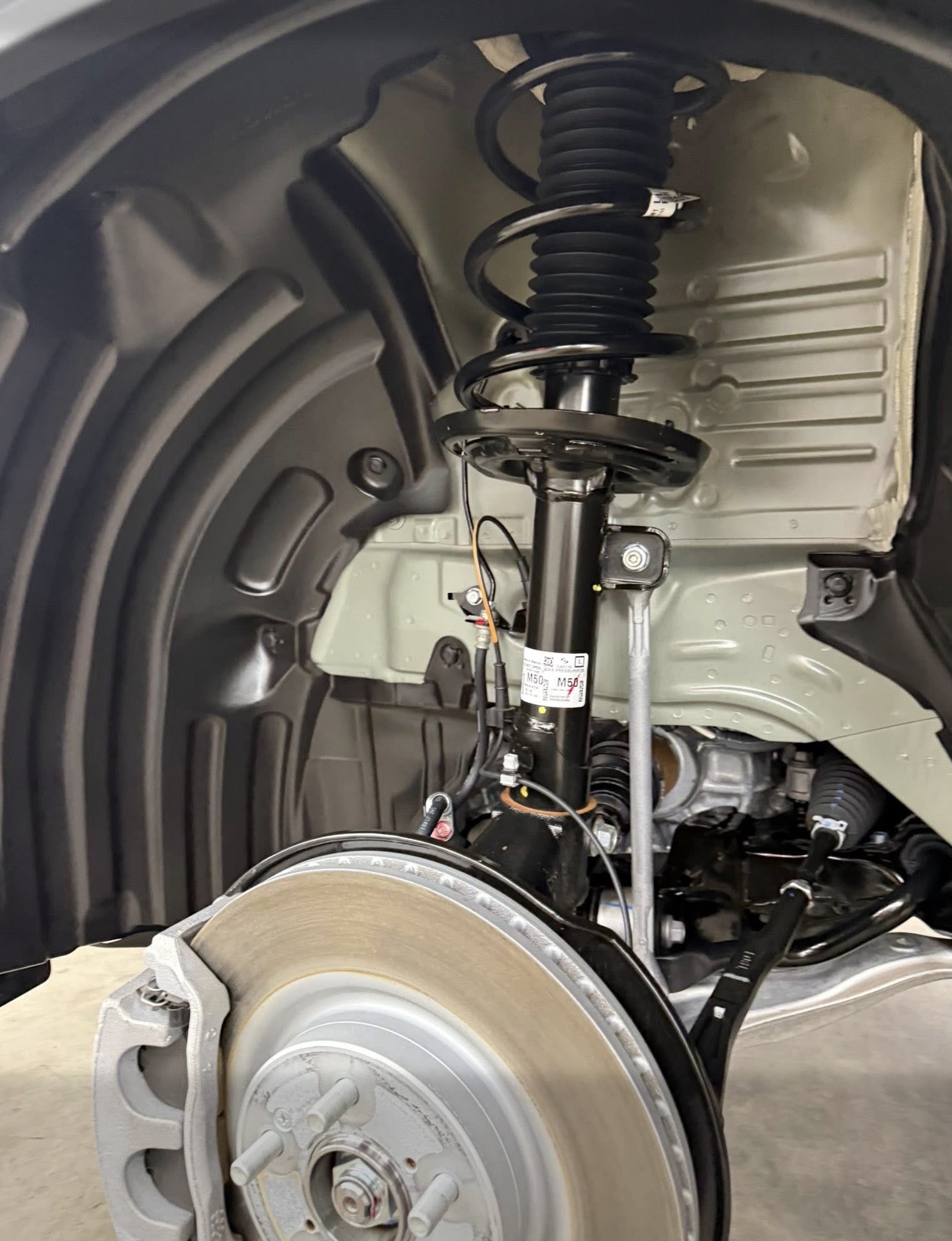 Detailed wheel well and suspension after a deep clean