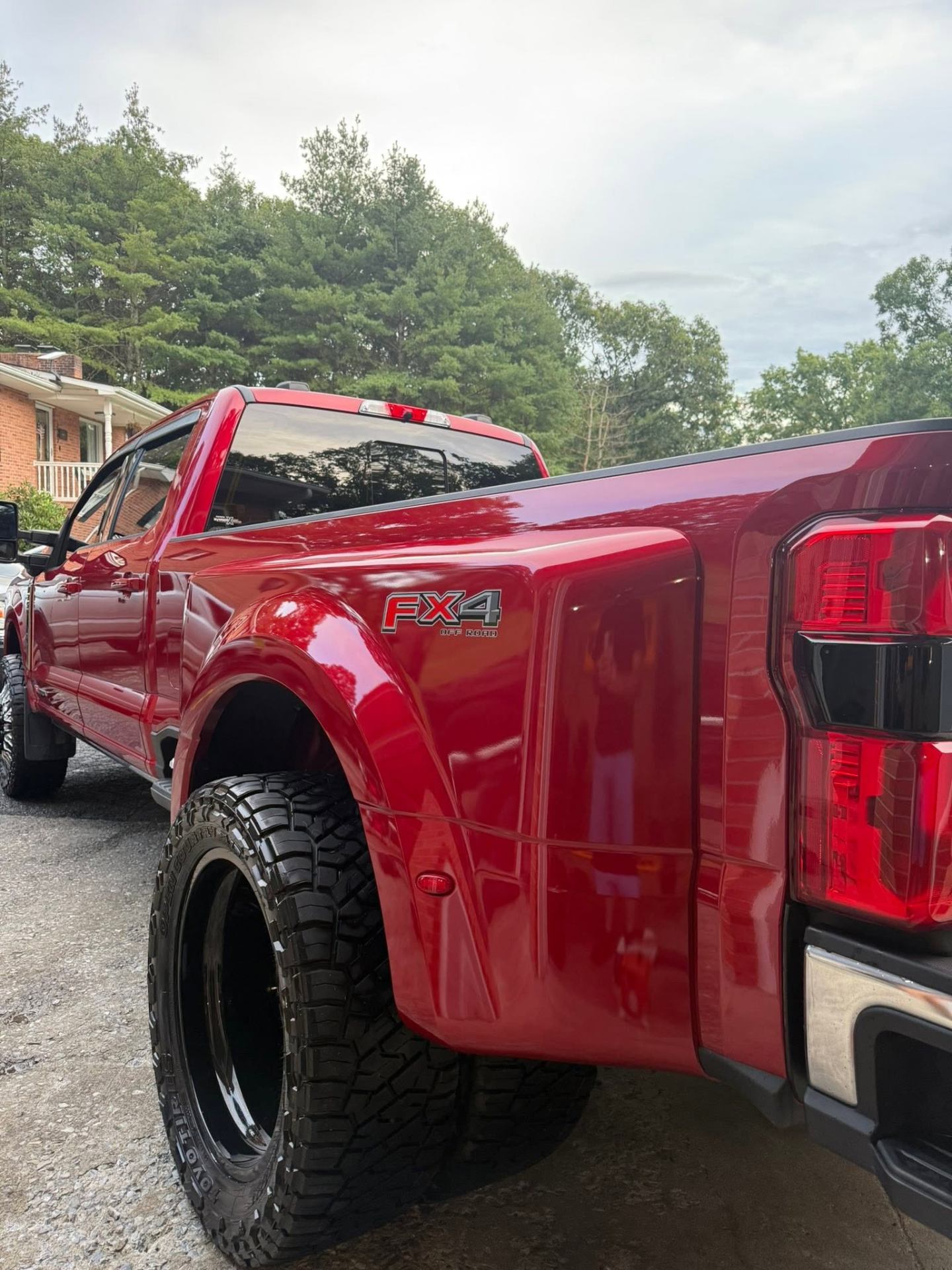 Red Ford dually truck with a deep polished shine